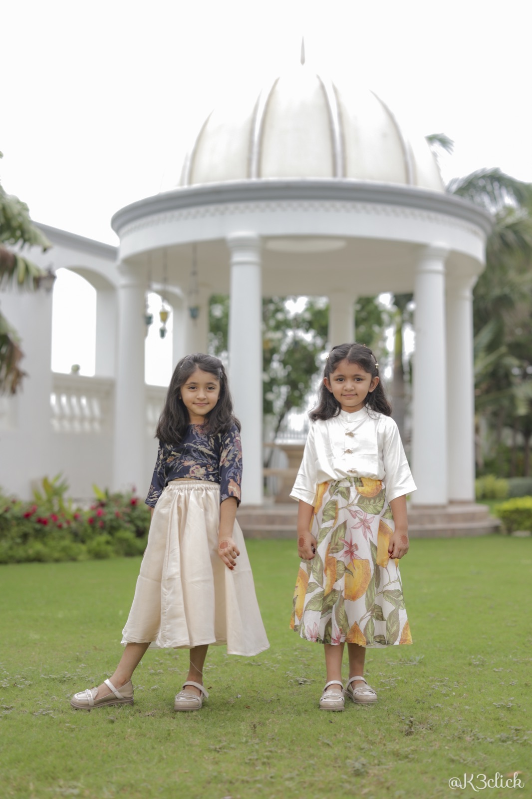 Sibling outfits: floral crop top, lemon-print skirt